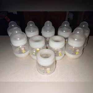 9- 4 oz. bottles 2 caps are missing 1 extra body and ring